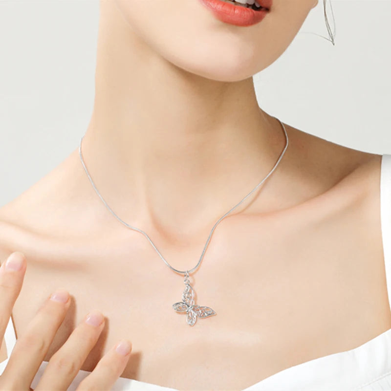 Sterling silver butterfly pendant necklace with filigree charm”