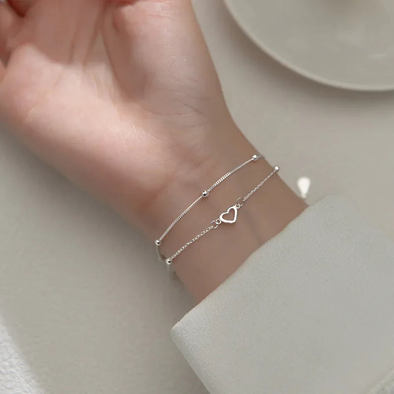 Minimalist silver chain bracelet with dainty butterfly charms