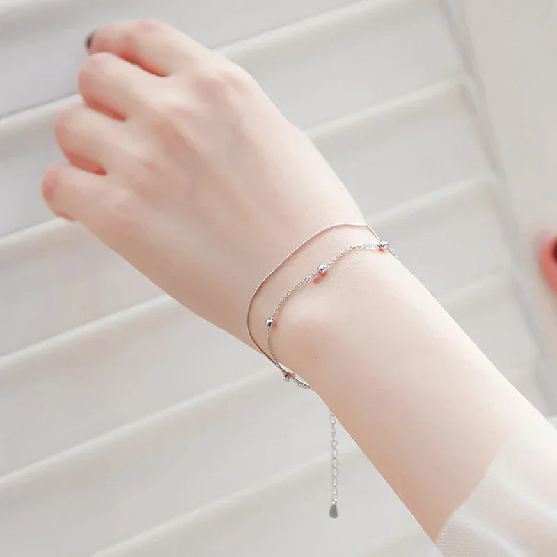 Minimalist silver chain bracelet with dainty butterfly charms