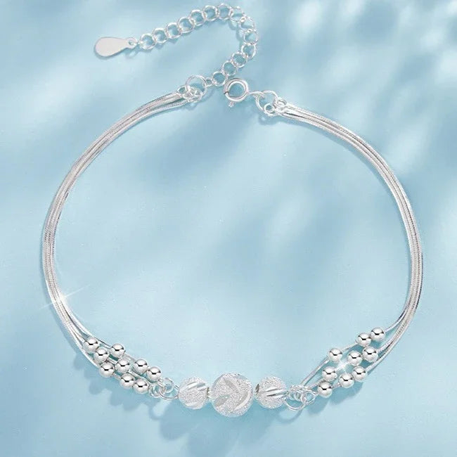 “Adjustable silver bead bracelet with sliding clasp minimalist design