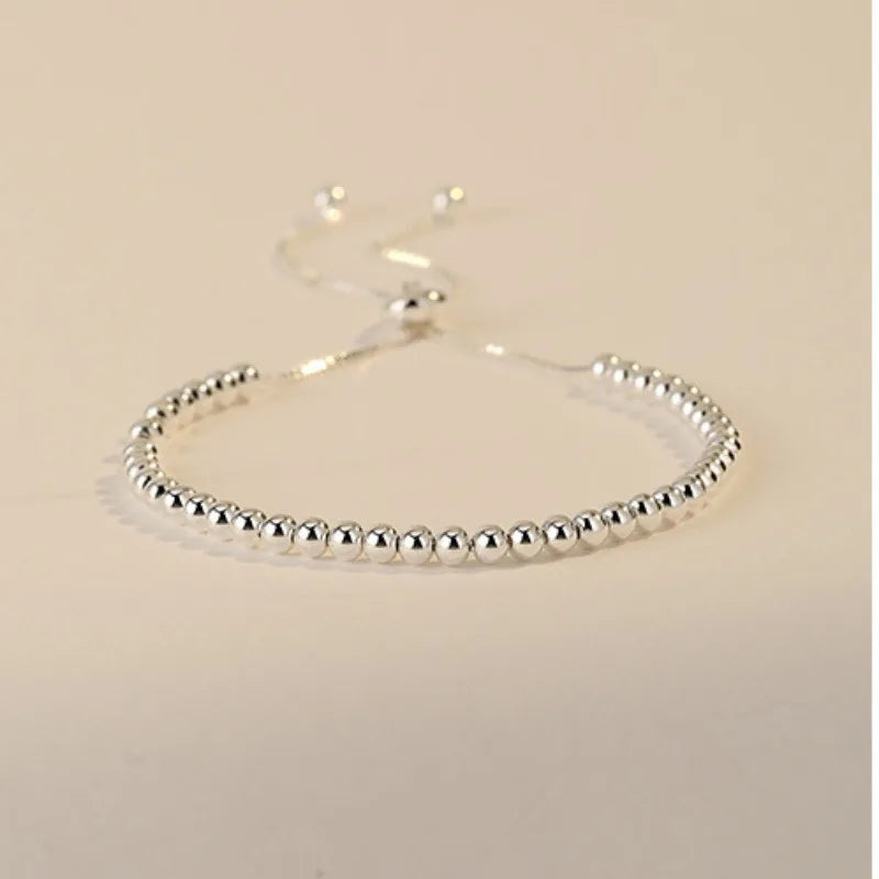 “Adjustable silver bead bracelet with sliding clasp minimalist design