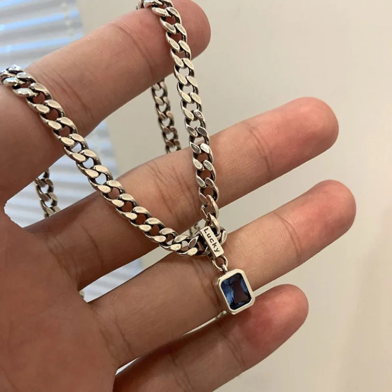 Chunky chain necklace with blue gem pendant for modern fashion