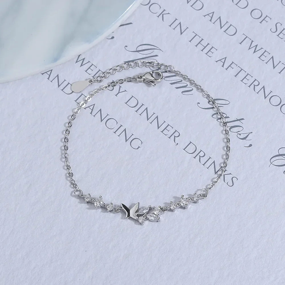Minimalist silver chain bracelet with dainty butterfly charms