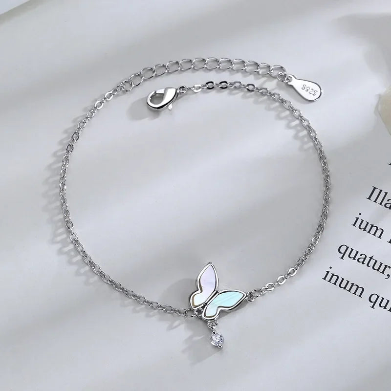 Minimalist silver chain bracelet with dainty butterfly charms