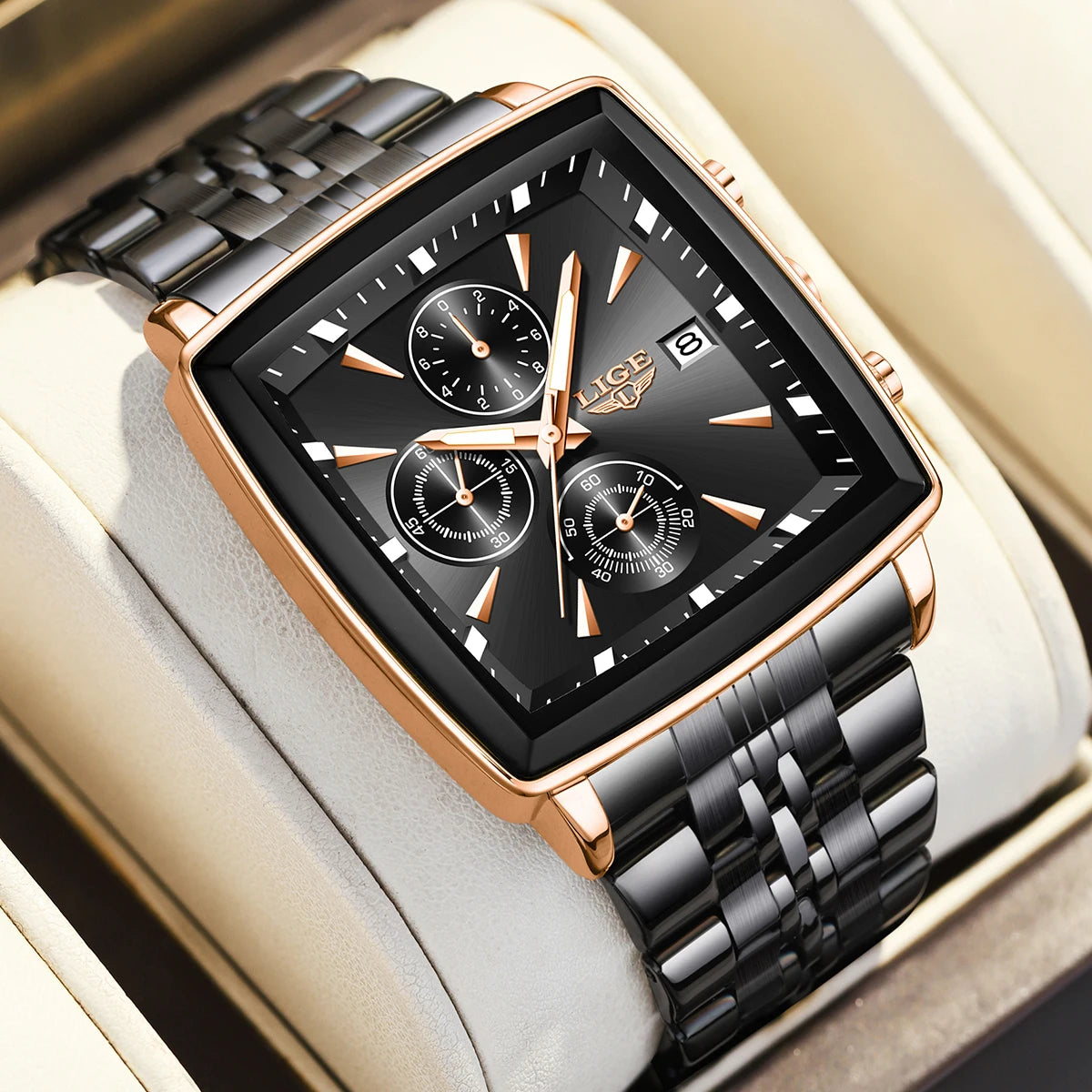 Luxury men’s square chronograph watch with black dial, gold case, and two-tone stainless steel bracelet”
