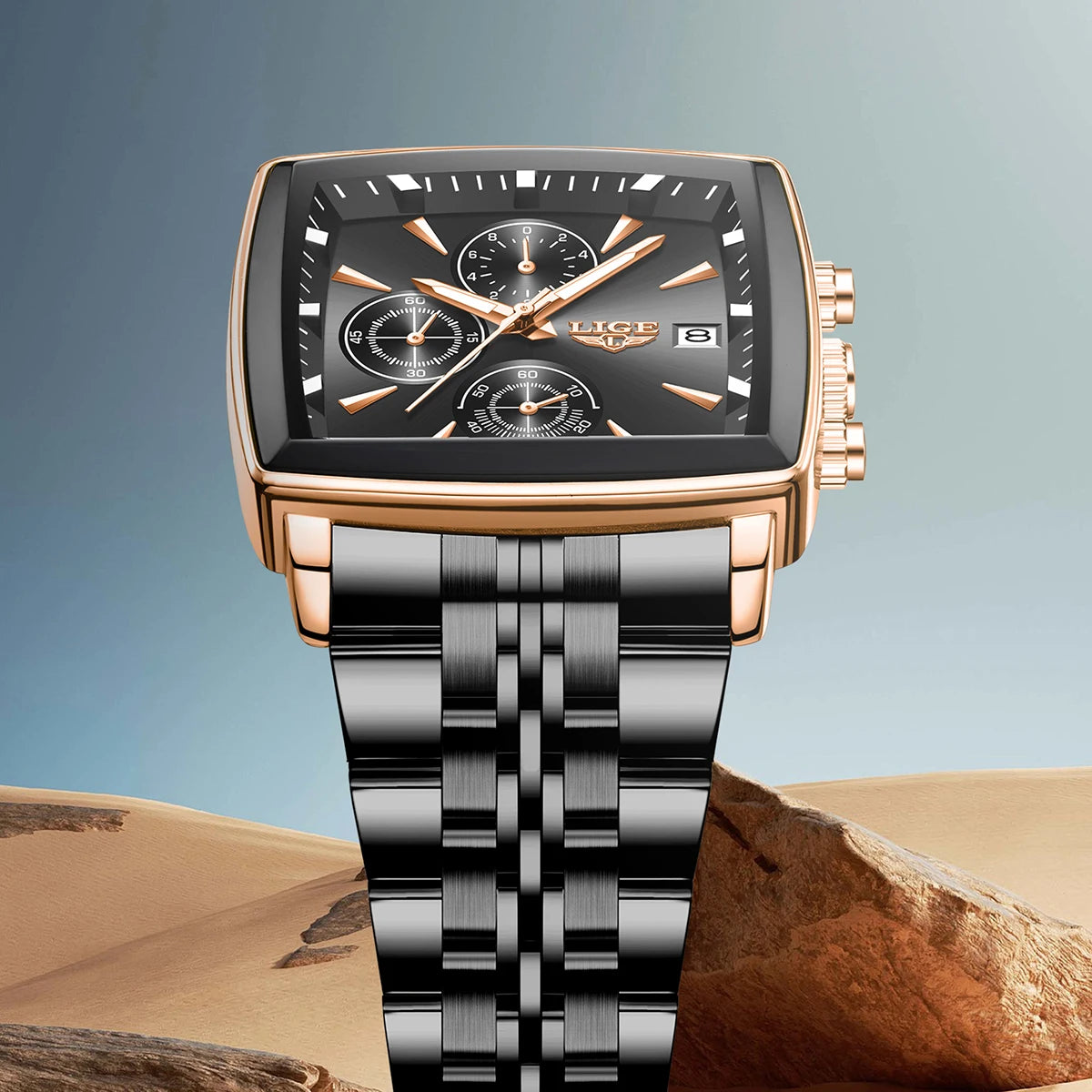 Luxury men’s square chronograph watch with black dial, gold case, and two-tone stainless steel bracelet”