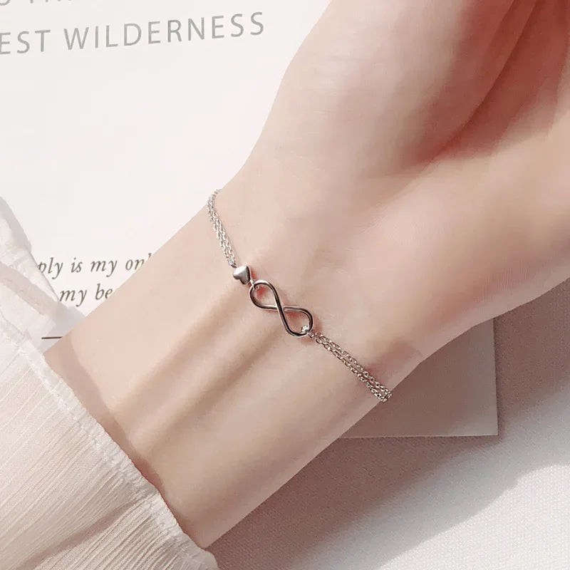Minimalist silver chain bracelet with dainty butterfly charms