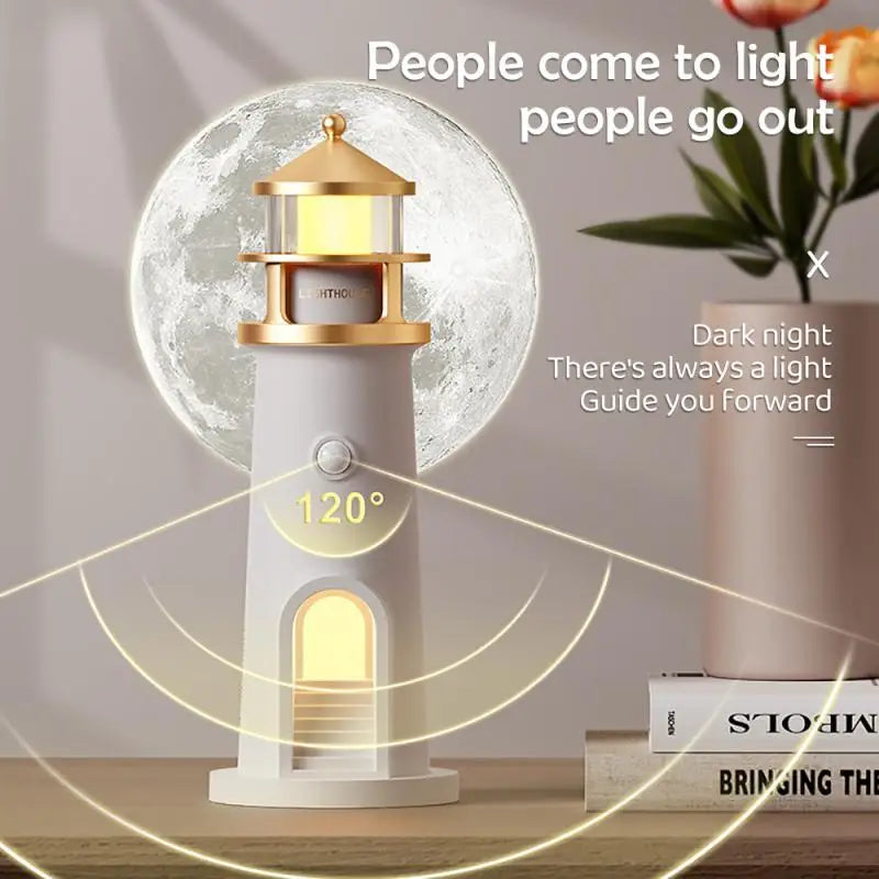 Lighthouse lamp and 3D moon night light on bedside table with vase and book