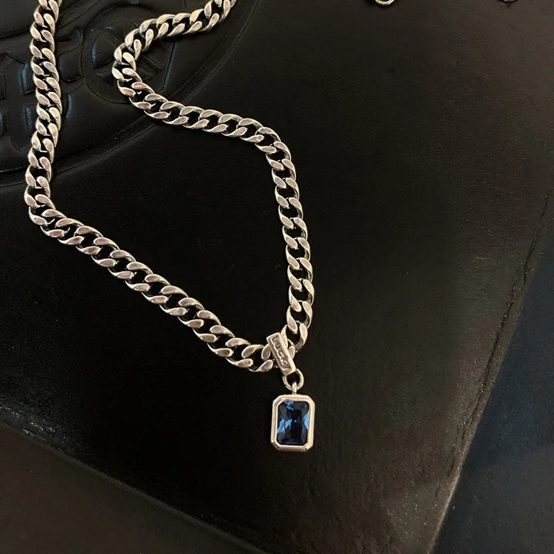 Chunky chain necklace with blue gem pendant for modern fashion