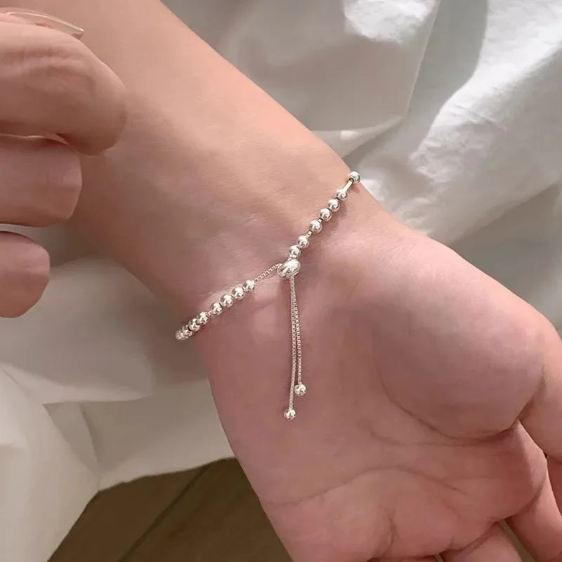 “Adjustable silver bead bracelet with sliding clasp minimalist design