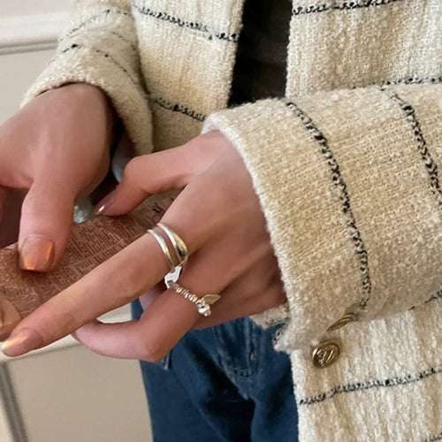 Set of minimalist silver knuckle rings including chunky band and beaded midi ring”