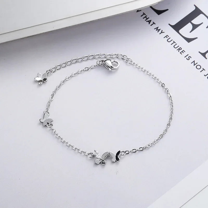 Minimalist silver chain bracelet with dainty butterfly charms