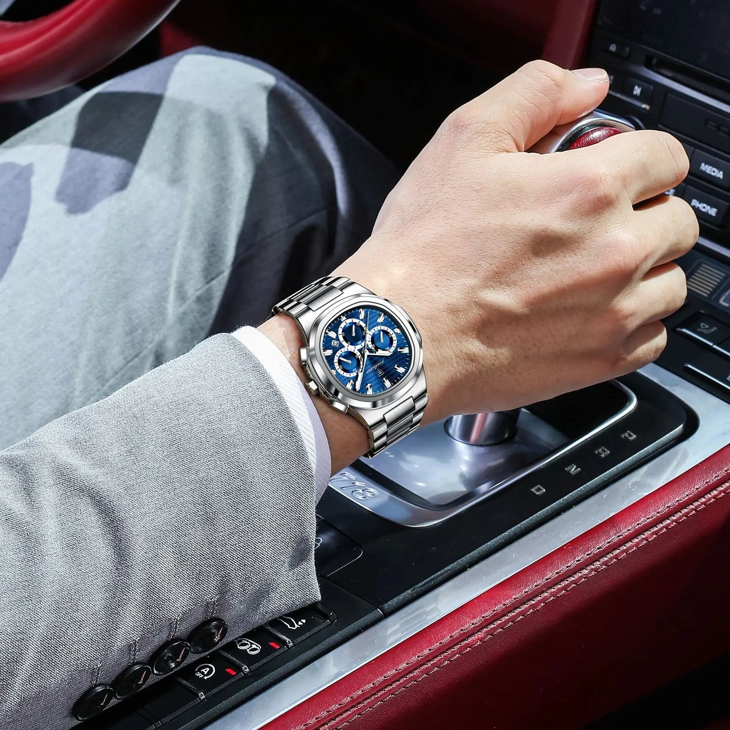 Luxury men’s blue chronograph watch with stainless steel bracelet, sporty dial, and multi-subdial features”