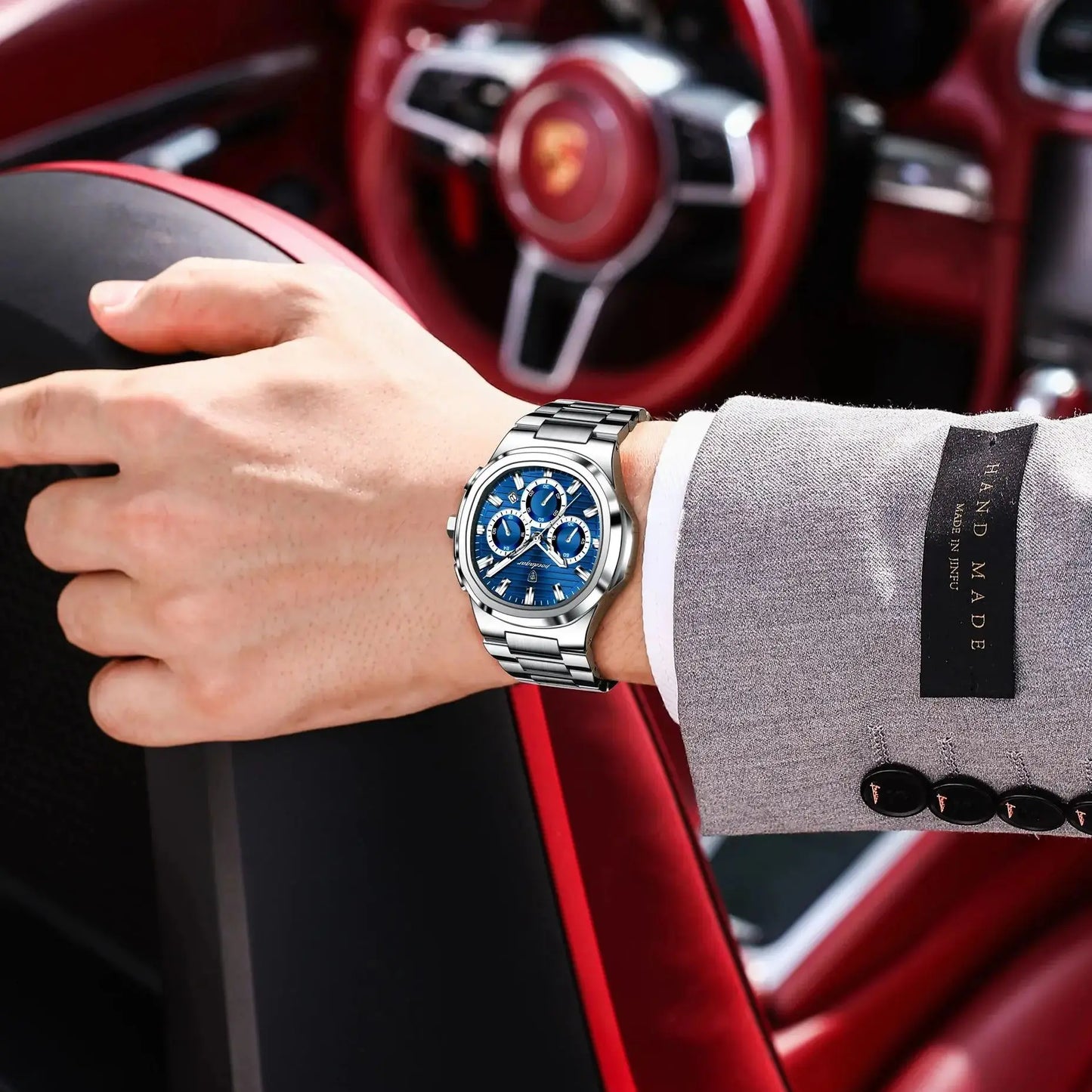 Luxury men’s blue chronograph watch with stainless steel bracelet, sporty dial, and multi-subdial features”