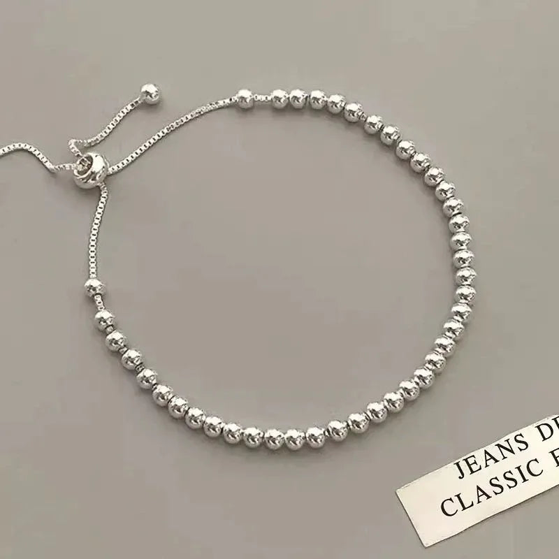 “Adjustable silver bead bracelet with sliding clasp minimalist design