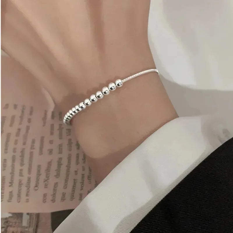“Adjustable silver bead bracelet with sliding clasp minimalist design
