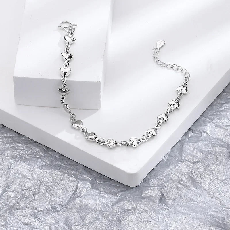 Minimalist silver chain bracelet with dainty butterfly charms