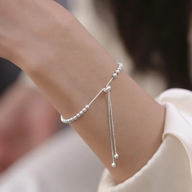 “Adjustable silver bead bracelet with sliding clasp minimalist design