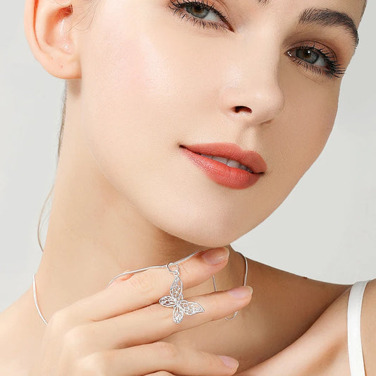 Sterling silver butterfly pendant necklace with filigree charm”