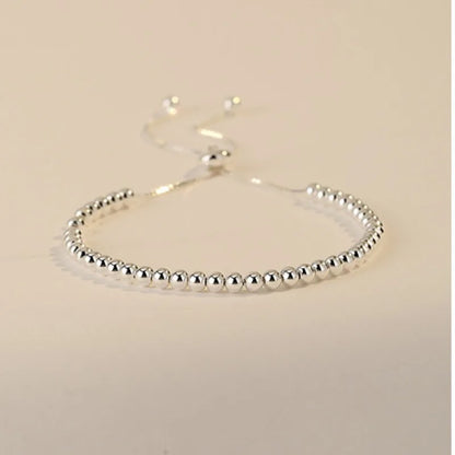 “Adjustable silver bead bracelet with sliding clasp minimalist design