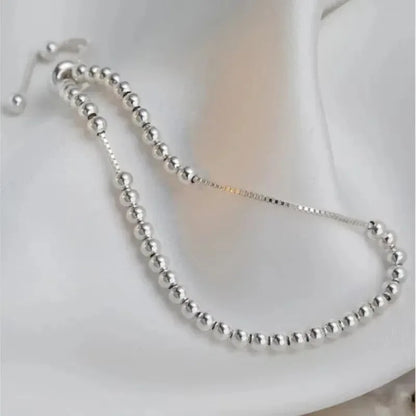“Adjustable silver bead bracelet with sliding clasp minimalist design