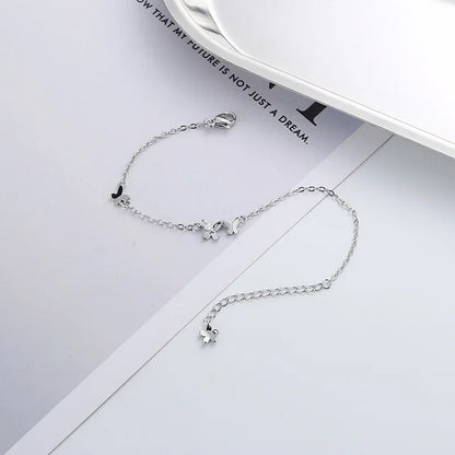 Minimalist silver chain bracelet with dainty butterfly charms