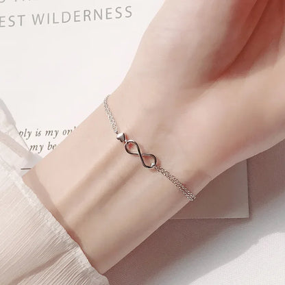 Minimalist silver chain bracelet with dainty butterfly charms