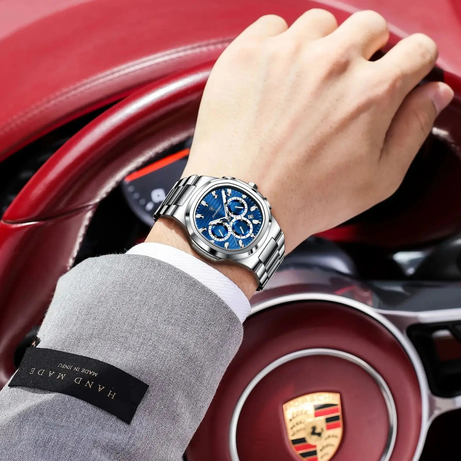 Luxury men’s blue chronograph watch with stainless steel bracelet, sporty dial, and multi-subdial features”
