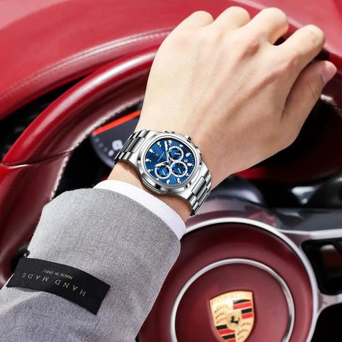 Luxury men’s blue chronograph watch with stainless steel bracelet, sporty dial, and multi-subdial features”