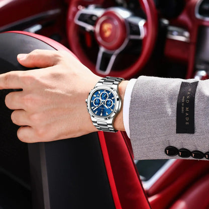 Luxury men’s blue chronograph watch with stainless steel bracelet, sporty dial, and multi-subdial features”