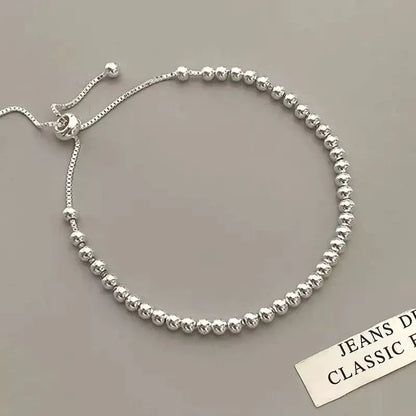 “Adjustable silver bead bracelet with sliding clasp minimalist design