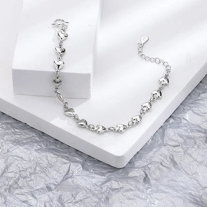 Minimalist silver chain bracelet with dainty butterfly charms